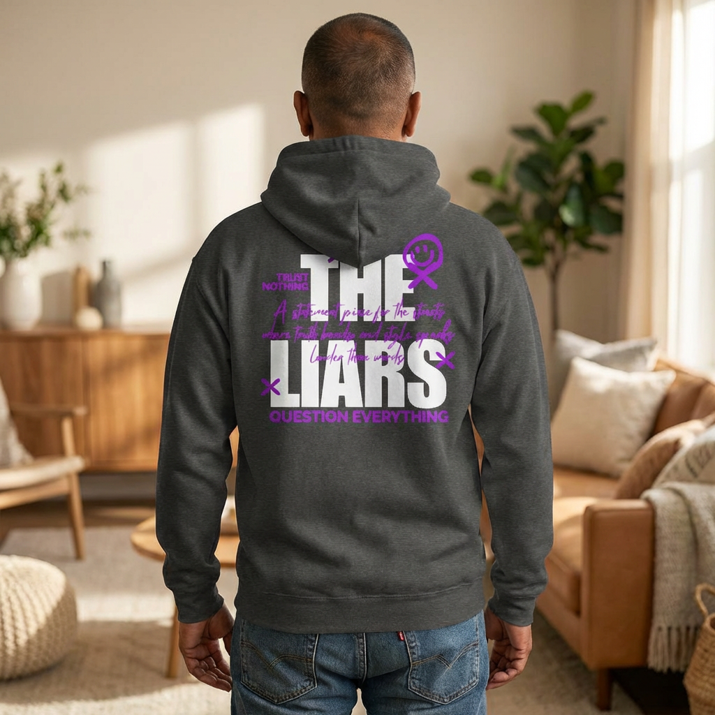 Person wearing a hoodie with text in a living room