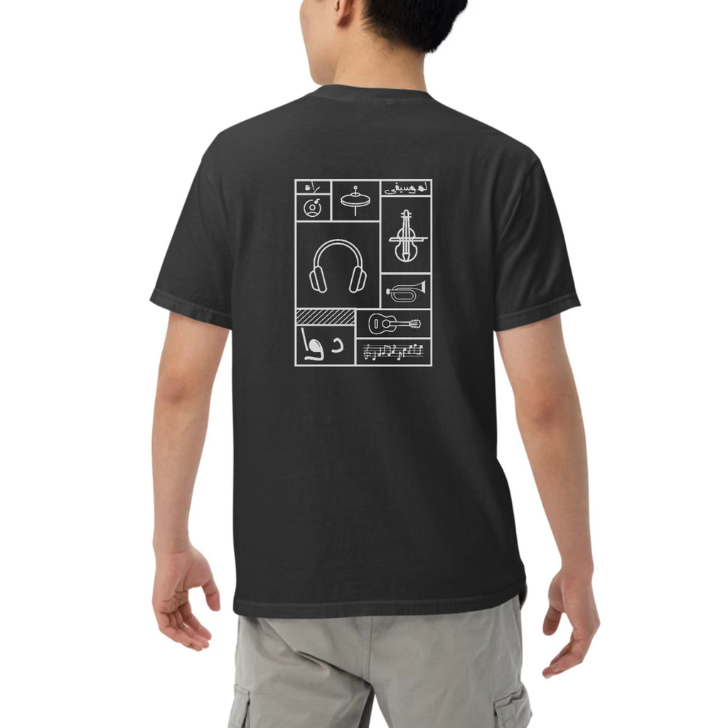 Person wearing a black t-shirt with white musical instrument icons on the back.