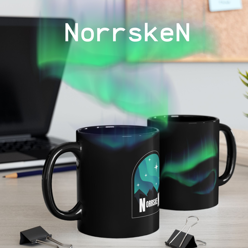 Two black mugs with a Northern Lights design and 'Norrskén' branding on a desk.