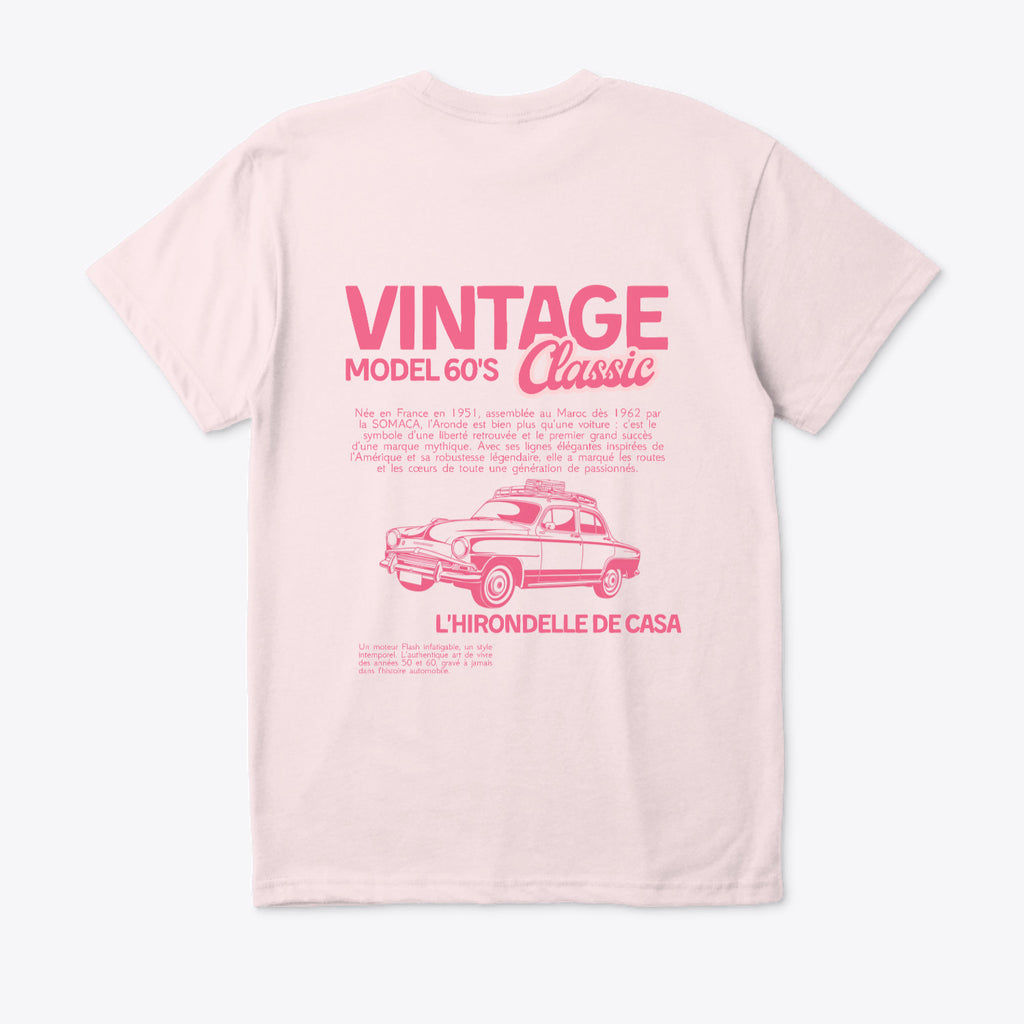 Pink t-shirt with vintage car design and text on a white background