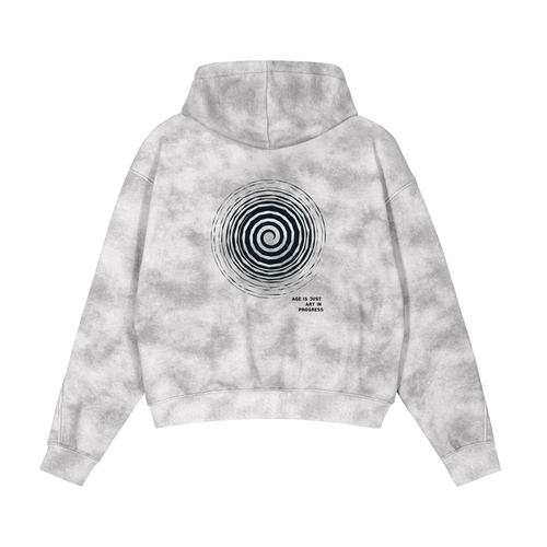 Gray tie-dye hoodie with a spiral design on the back against a white background