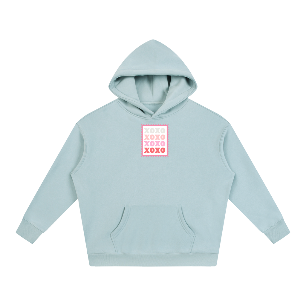 A light blue pullover hoodie with a pink and white 'XOXO' graphic on the chest, displayed flat against a solid white background.
Light Blue hoodie featuring a vintage-inspired XOXO postage stamp graphic centered on the chest, symbolizing affection, love, and heartfelt connection.