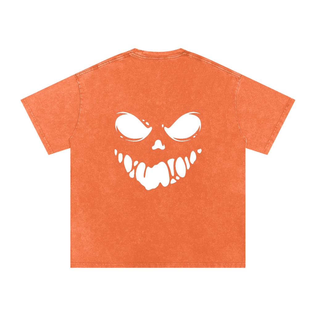 Orange t-shirt with a white skeleton face design on a white background